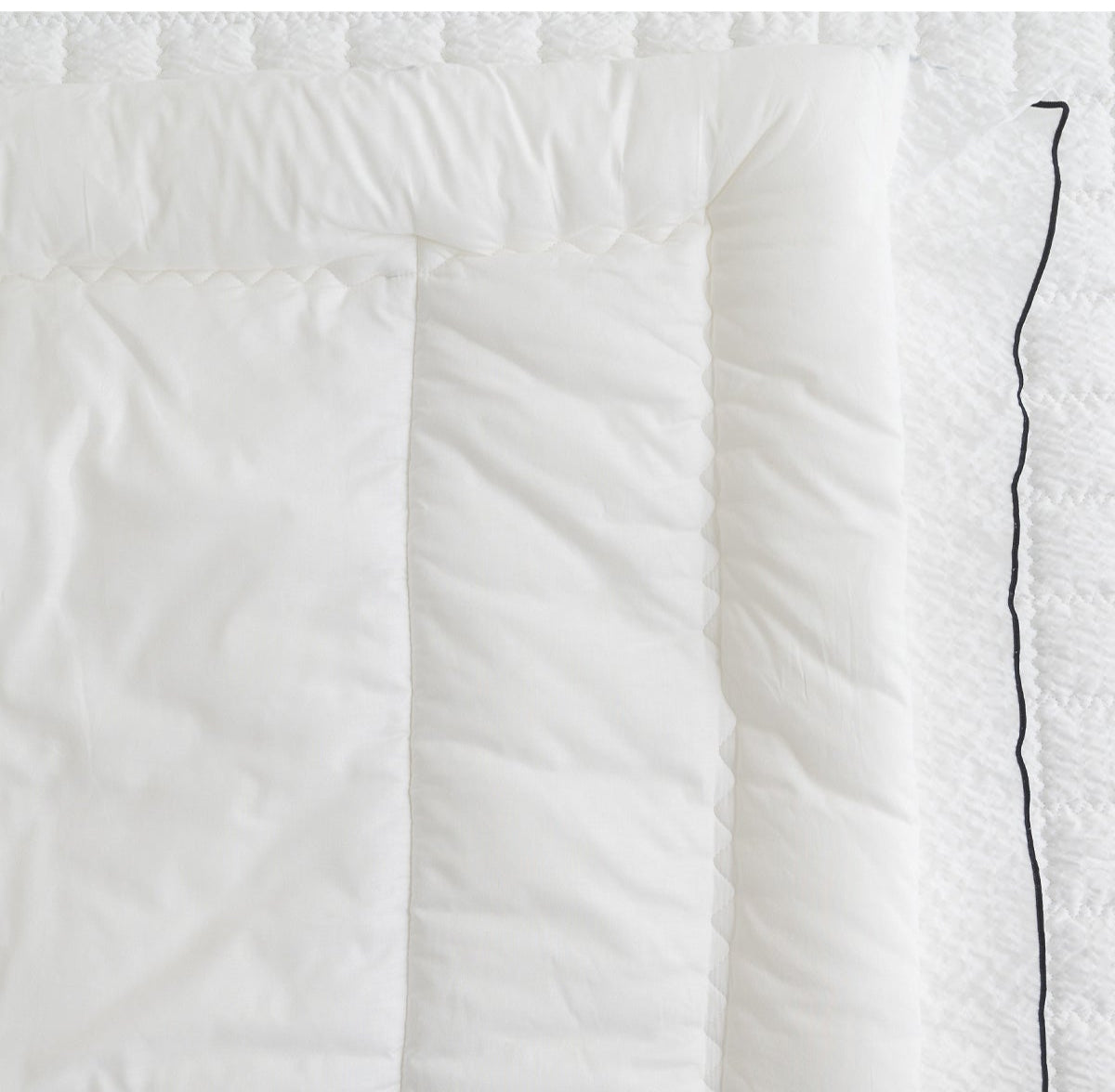 Stylish Black Piping and Square Quilting for Durable Design

